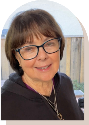 Smiling woman with glasses and short brown hair