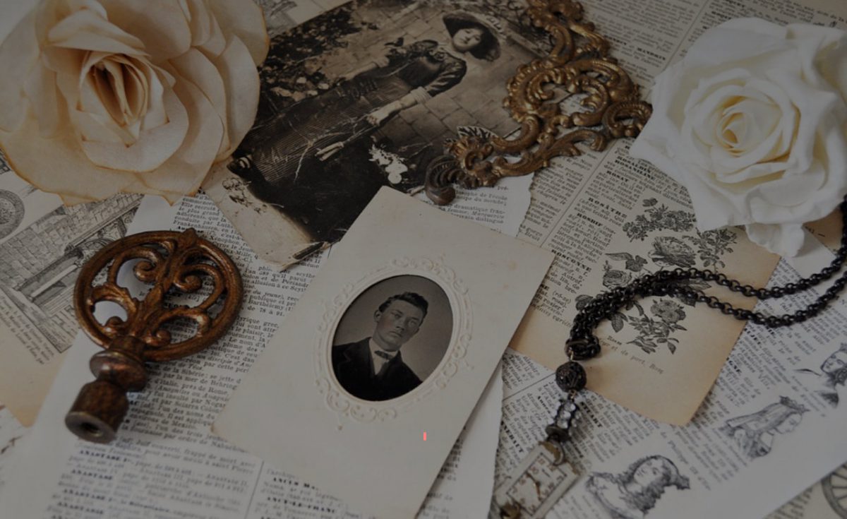 Vintage portrait with roses, ornate key, rosary