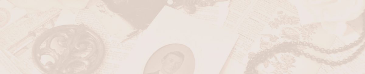 Antique jewelry and sepia photographs on table